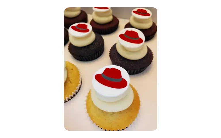 Custom branded cupcakes with Redhats logo